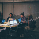 People working on laptops in an office building