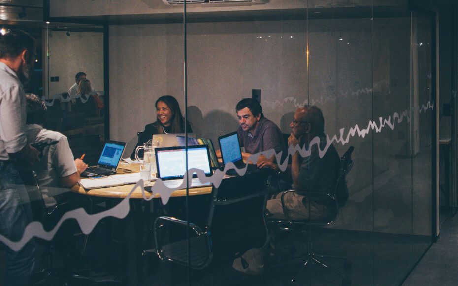 People working on laptops in an office building